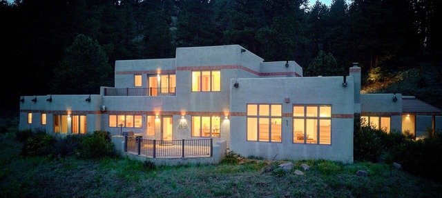 Amazing mountain home on 126 acres bordering national forest land in Woodland Park
