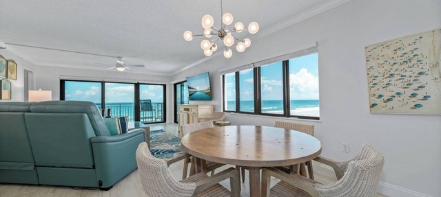 Direct oceanfront southern corner 2/2 condo with large wrap-around balcony and heated pool in New Smyrna Beach