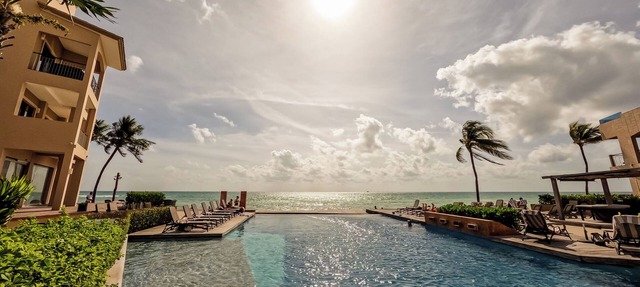 Ocean ElegancenContemporary Beachfront Escape at El Faro Resort Living in Playa del Carmen